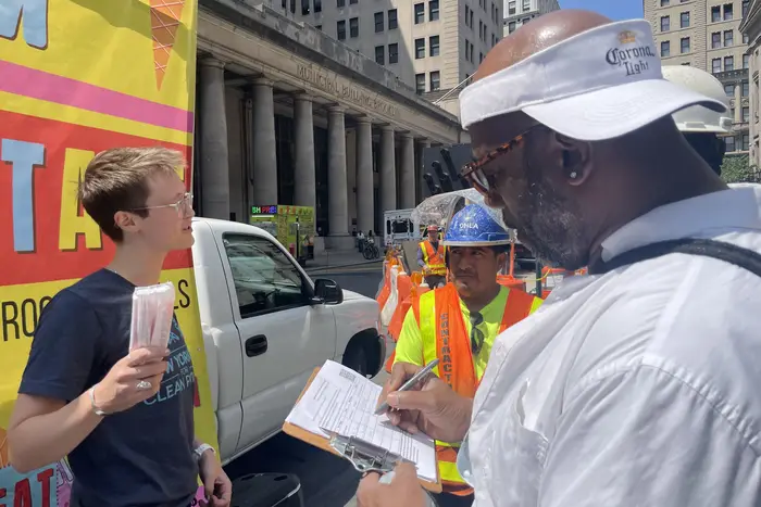Volunteers educated the public at lunch time about the NY HEAT Act — a bill that proposes affordable ways to phaseout natural gas